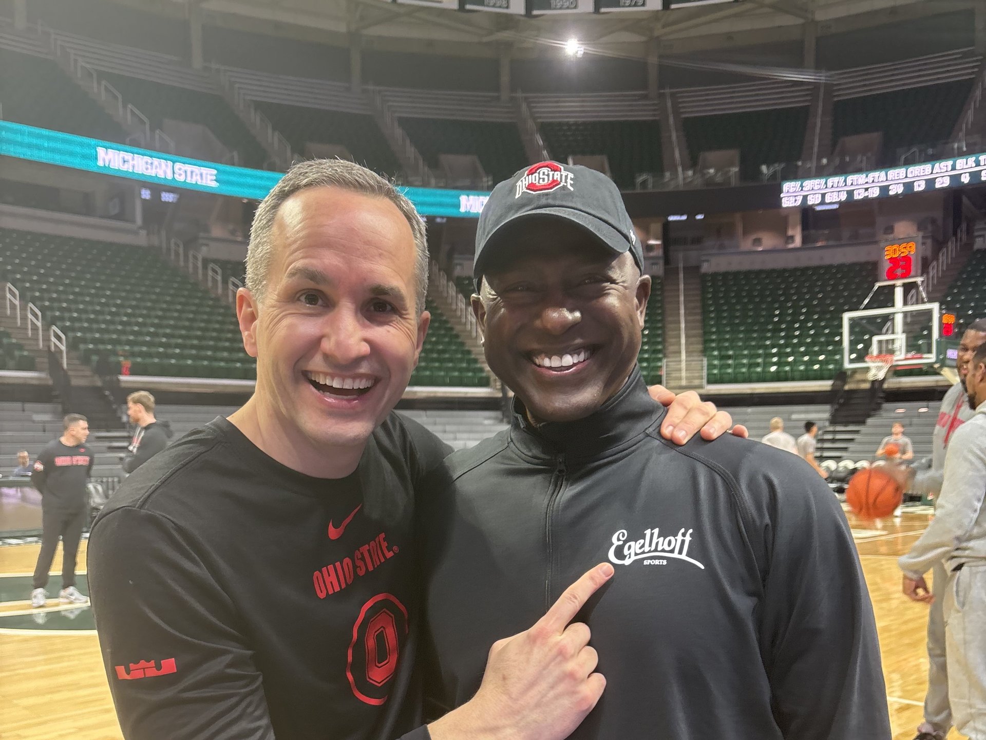 Two men at a Big Ten basketball arena; one wearing an Egelhoff Sports embroidered pullover